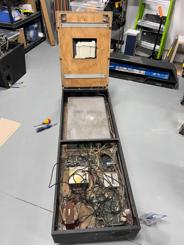 Daytona USA Twin Cab base opened with seat tilted back exposing all PCBs.