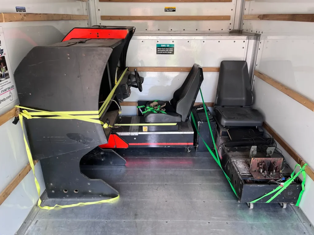 Daytona USA Twin cabinets loaded into the truck on their way to get refurbished.