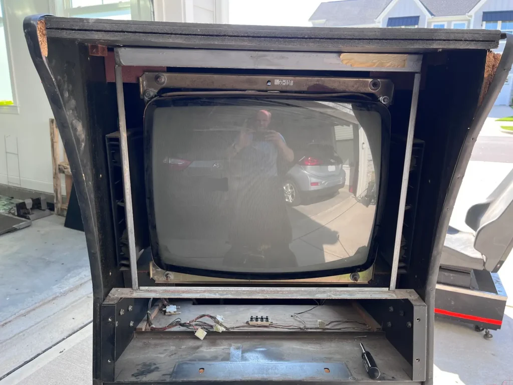 Daytona USA Twin cabinet monitor mounted in the vertical cabinet.
